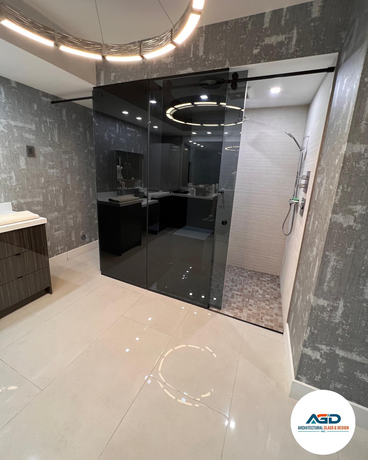 Custom floor-to-ceiling frameless shower enclosure