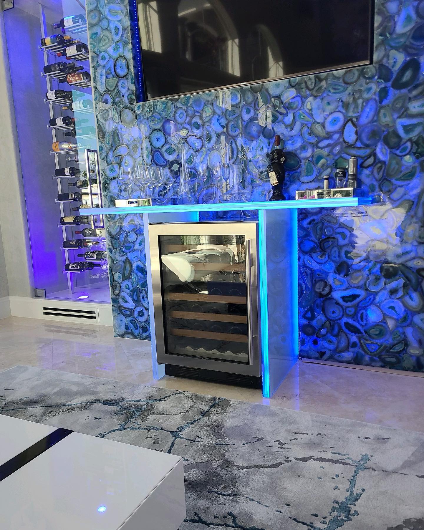 Floor-to-ceiling glass wine room installed in a luxury residence