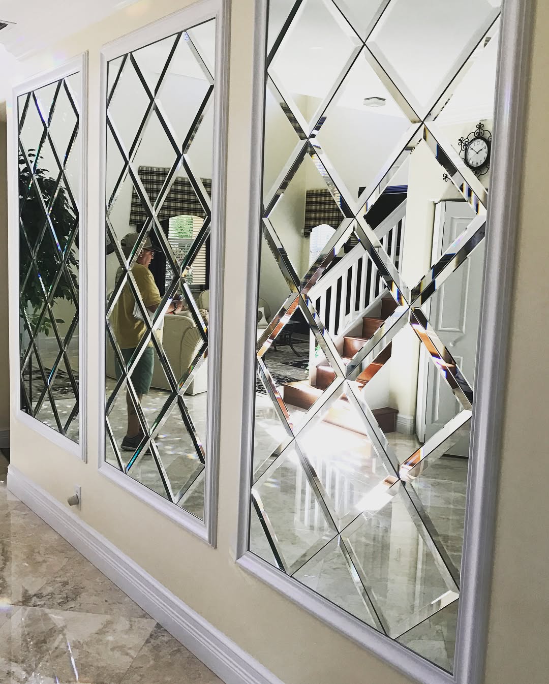 Custom decorative wall mirror installation by Architectural Glass and Design